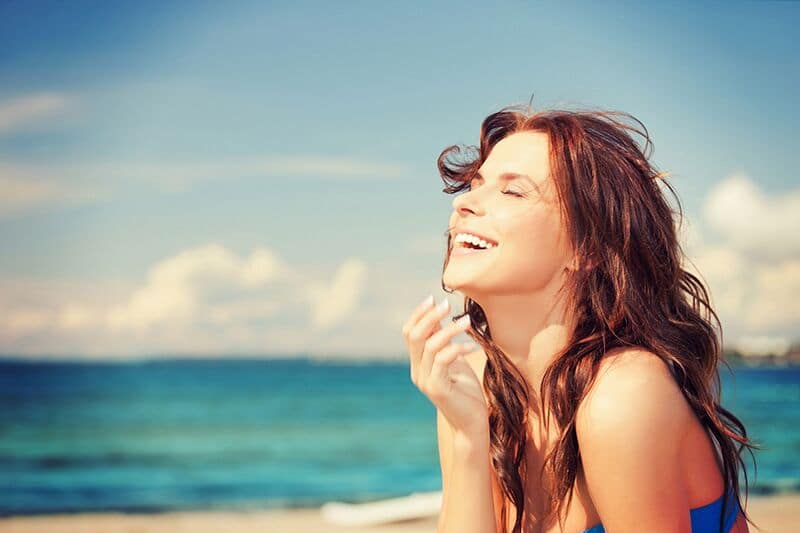 smiling woman at the beach