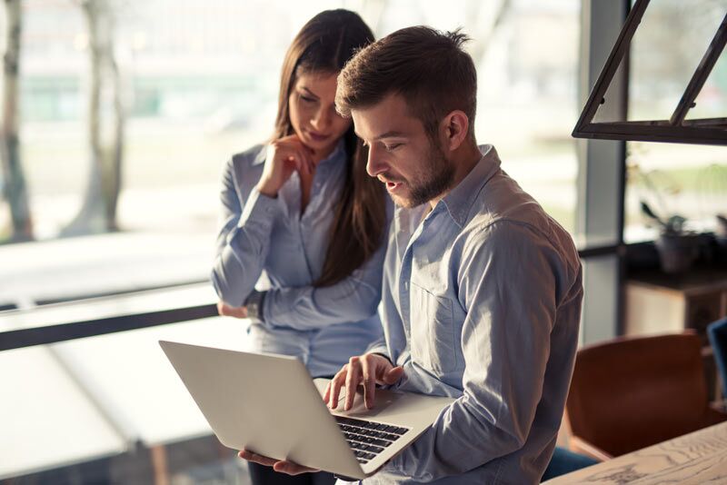 hotel employees working on laptop