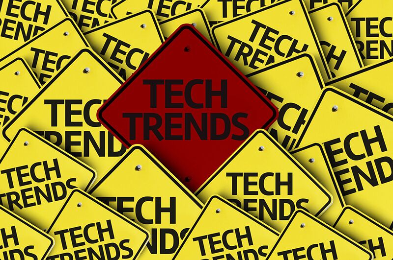 yellow signs that read "tech trends"